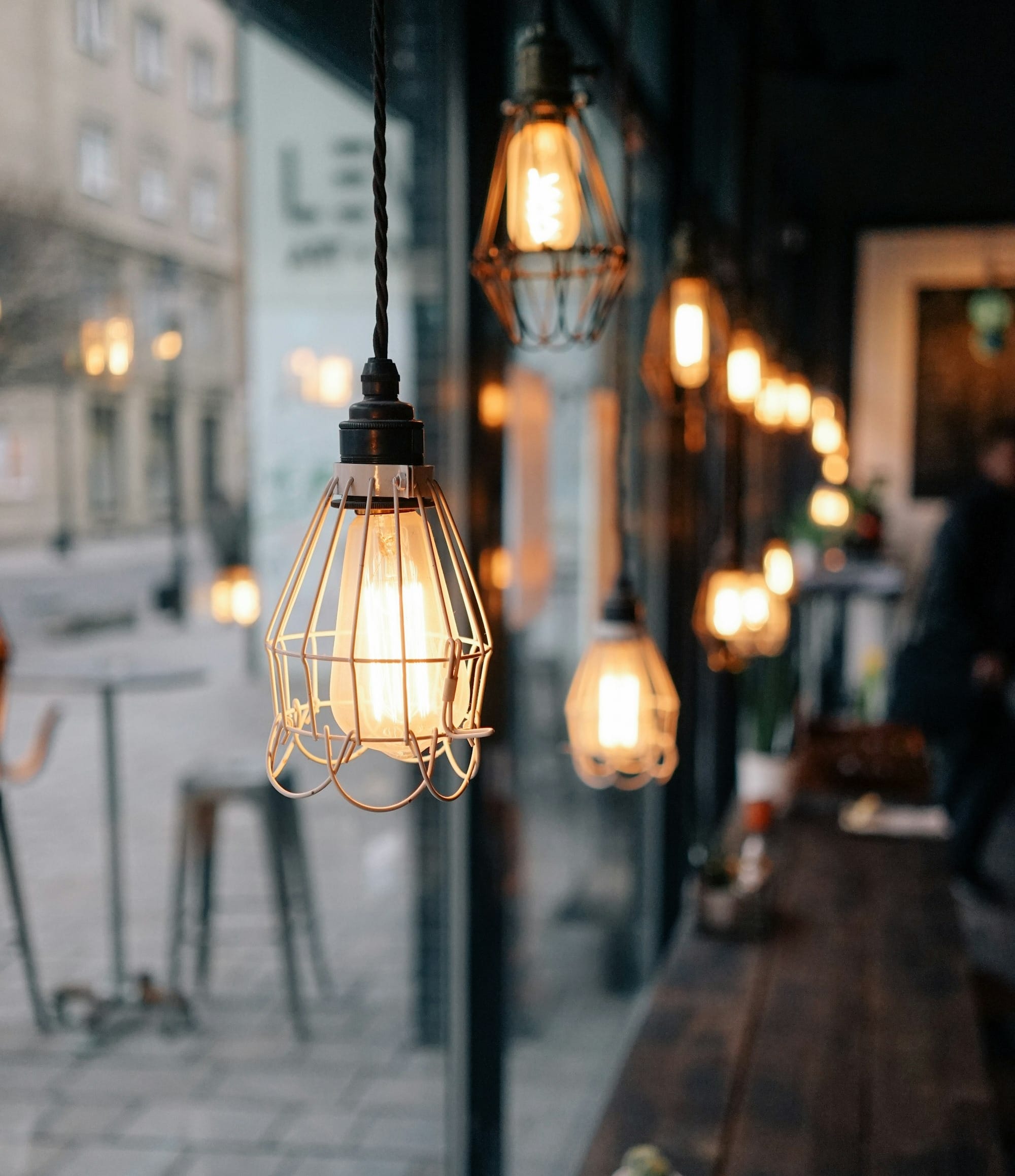 shallow focus photography of store pendant lamps