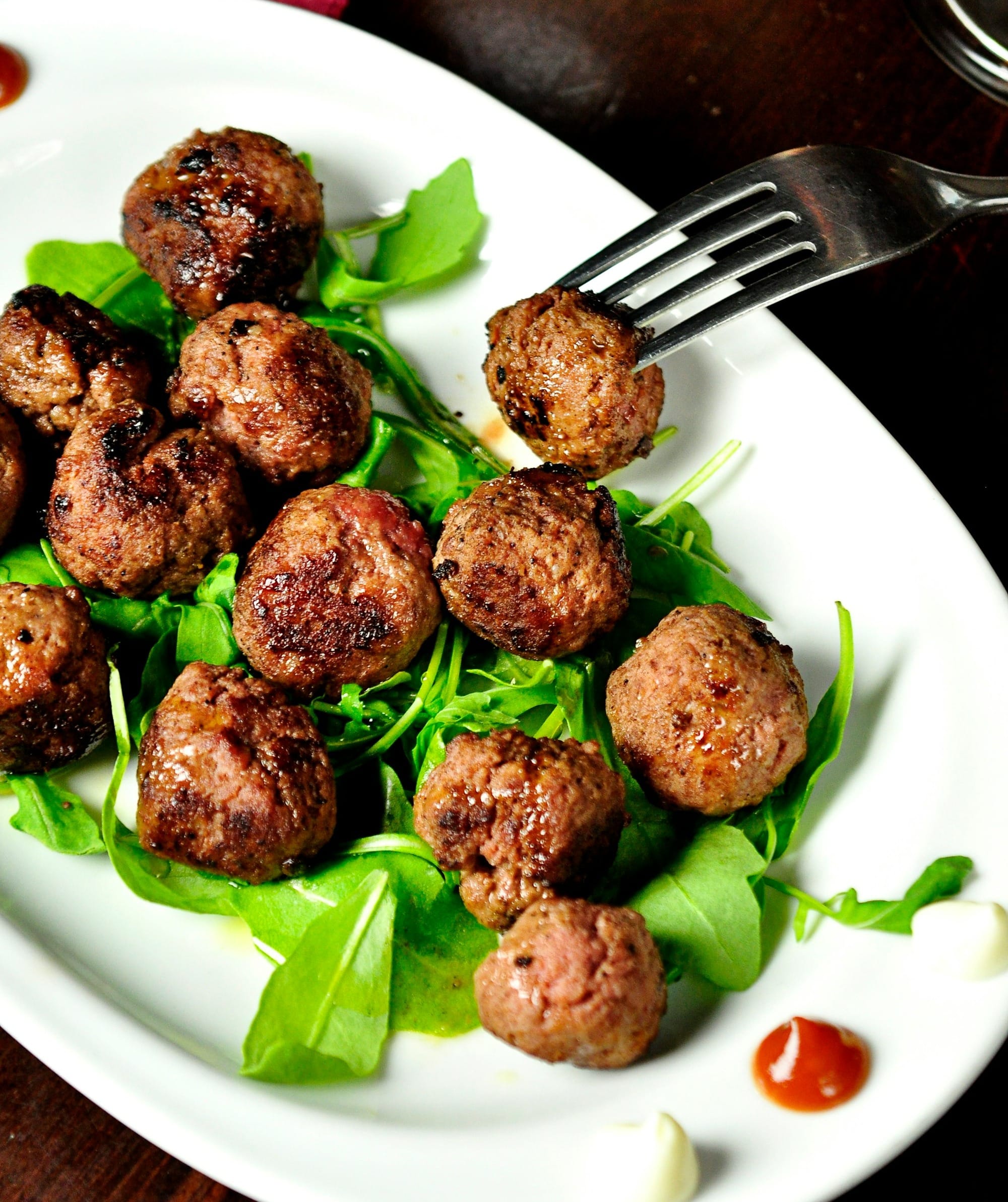 meat balls on oval white plate